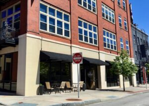 A look at the outside of Vesper's entrance, located in the Capron Street Lofts brick building