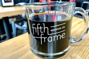 Filled coffee mug at Fifth Frame Brewing
