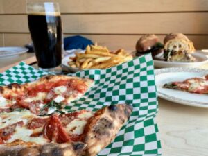 Pizza, beer, and a sandwich