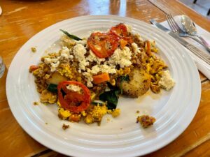 Voula's Vegan Mt. Olympus dish with roasted lemon potatoes, tofu scramble, lentils and vegetables.