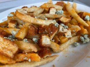close up of loaded Buffalo Fries at Strong Hearts Syracuse