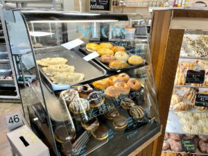 Display case of vegan donuts at Golden Harvest Cafe and Bakery