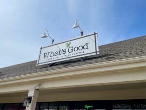 Sign about What's Good with the tagline 'Shop & Refill with Purpose'