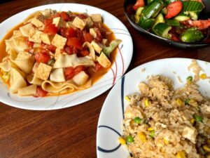 Three vegan dishes at Season's Noodle, Cucumber and Tomato Salad, Tomato & Tofu Noodle, and Tofu fried rice.
