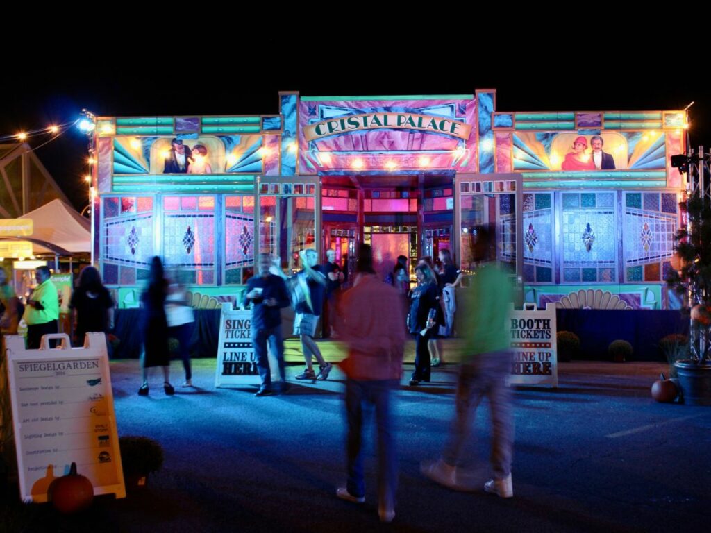People enjoying the Spiegelgarden at Rochester Fringe