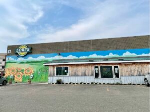 Entrance to Lori's showcasing the sunflower mural on the building
