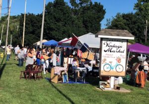 Photo of past Upstate vintage flea market, outdoors with vendor tents