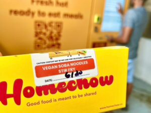 Yellow Homechow food packaging showing the 'vegan soba noodles stir fry' label