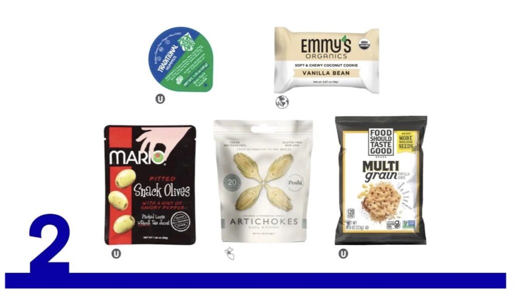 SavorUp Snack Box includes tortilla chips, hummus, olives, artichokes, and a vanilla bean coconut cookie