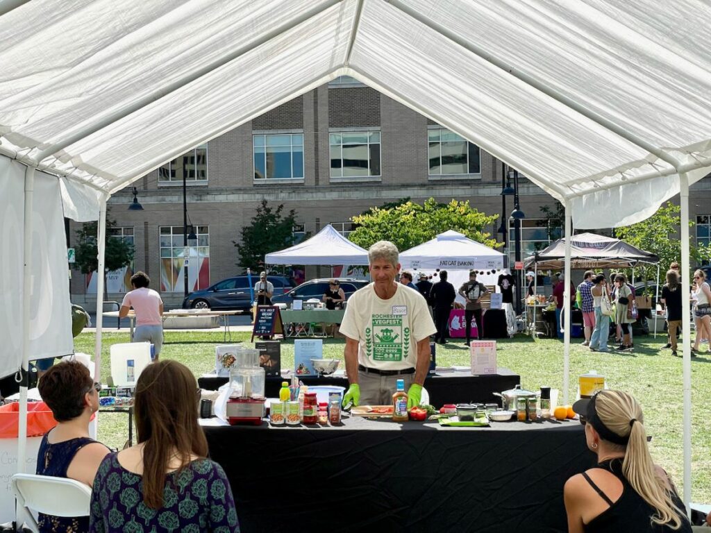 Cooking demo under a tent during the VegFest